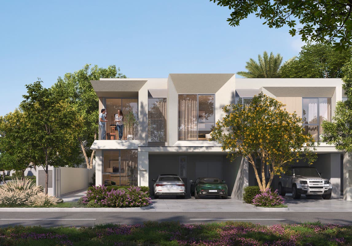 Townhouse pair with driveway parking on a landscaped street at The Valley